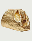 Gold textured handbag on a light gray background
