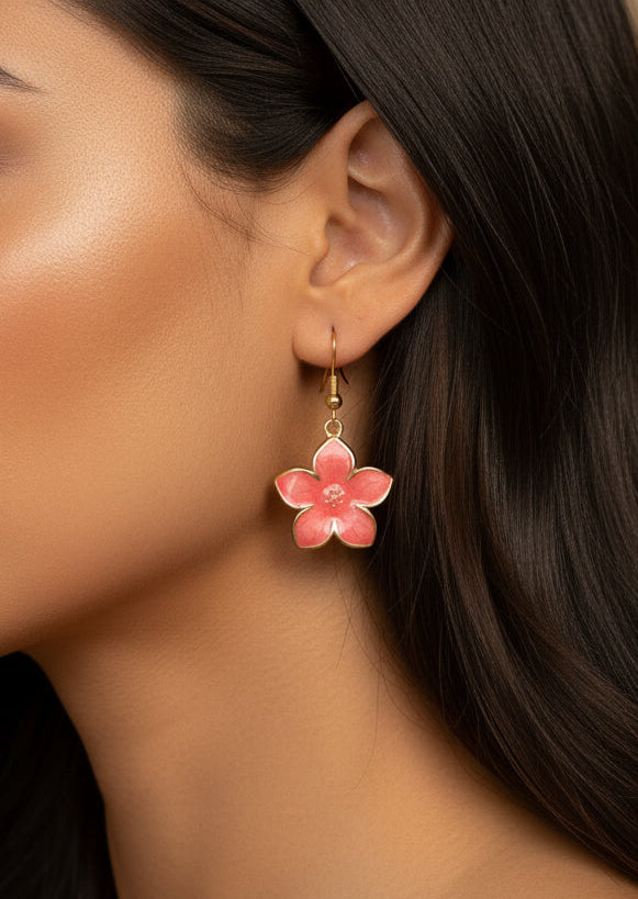 Close-up of a woman wearing pink flower earrings with a neutral background