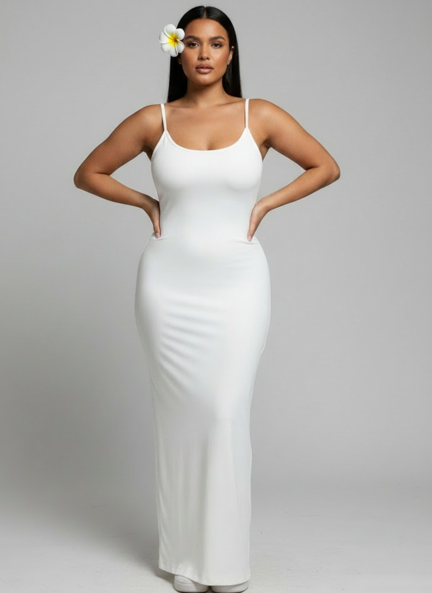 Woman wearing a white dress against a gray background