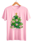 Pink t-shirt with a Christmas tree design on a hanger against a white background