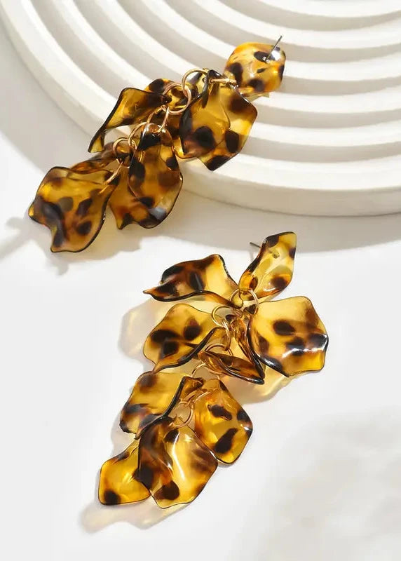 Tortoiseshell leaf-shaped earrings on a white background